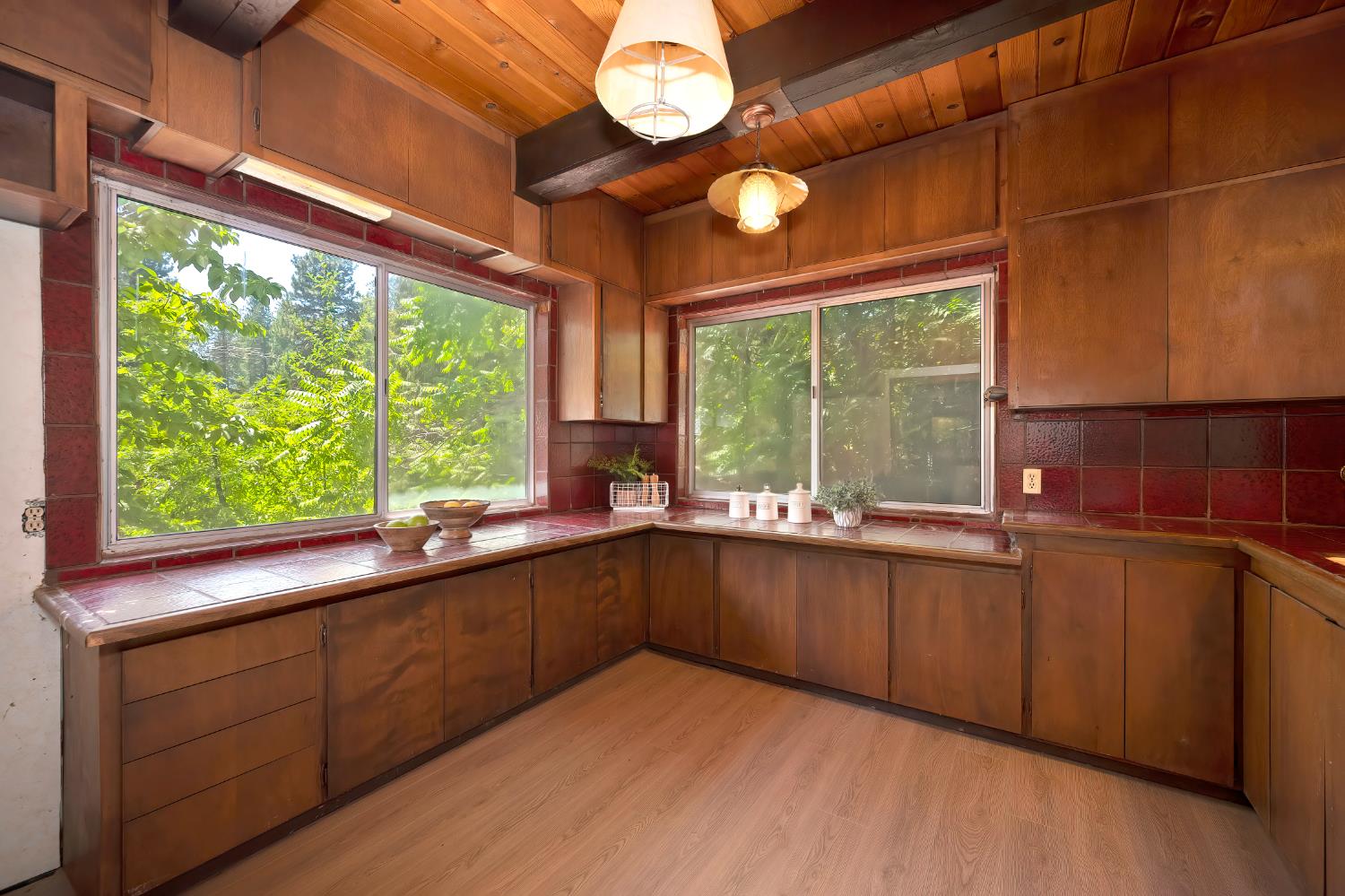 31055 Gold Run Road Gold Run, CA 95717 - Photo 17 of 35 a kitchen with wooden cabinets and a large window