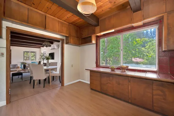 a view of a dining room with furniture window and outside view