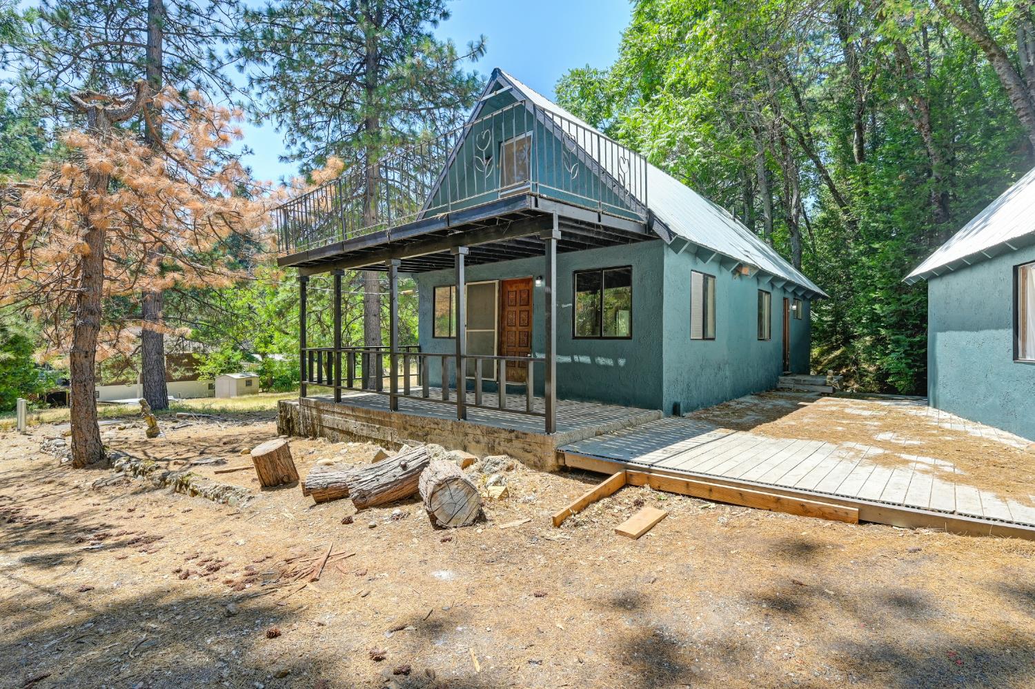 31055 Gold Run Road Gold Run, CA 95717 - Photo 3 of 35 a backyard of a house with seating space