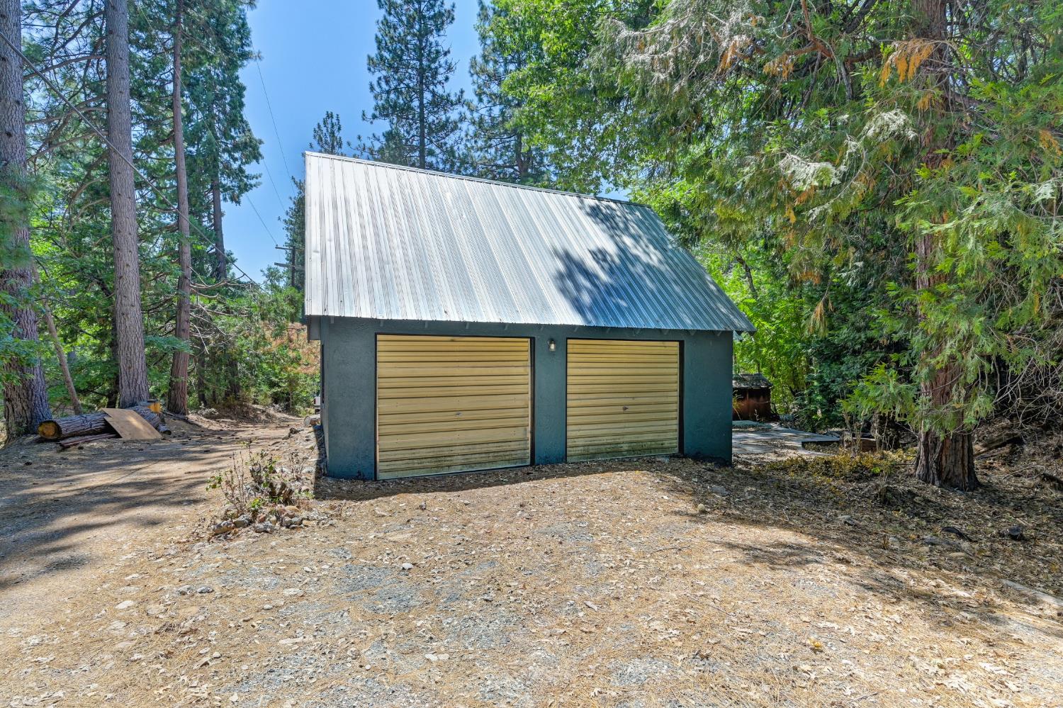 31055 Gold Run Road Gold Run, CA 95717 - Photo 5 of 35 a view of a small house with a small yard and large tree