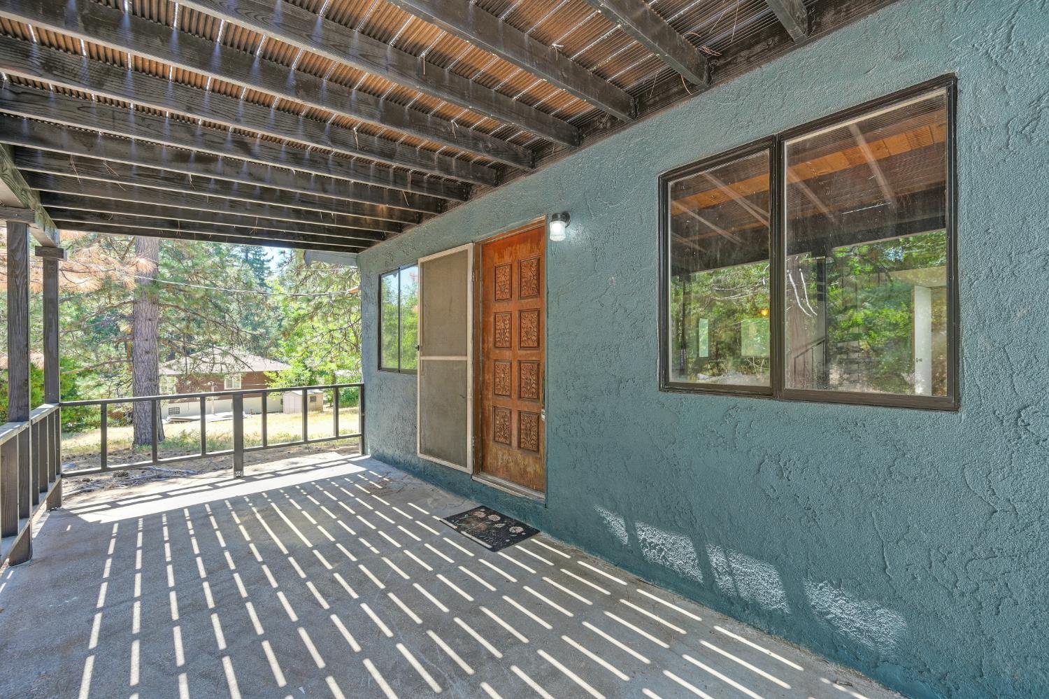 31055 Gold Run Road Gold Run, CA 95717 - Photo 7 of 35 a view of porch with wooden floor and outdoor space