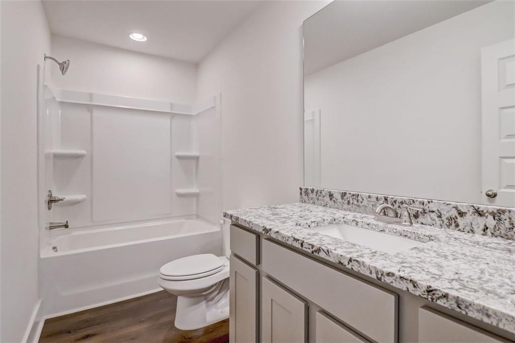 172 Loyd Road Mansfield, GA 30055 - Photo 15 of 17 a bathroom with a granite countertop sink toilet and shower