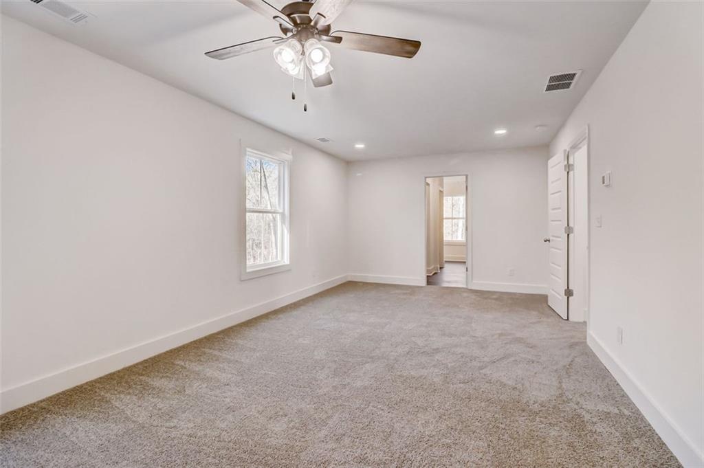 172 Loyd Road Mansfield, GA 30055 - Photo 6 of 17 wooden floor in an empty room with a window