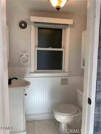 a bathroom with a toilet and a sink