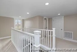 a view of hallway with bedroom