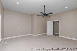 a view of a room with a ceiling fan