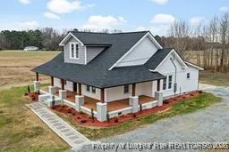 a view of a house with a yard and balcony