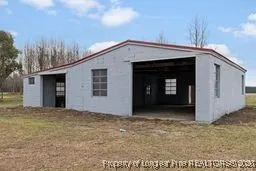 a view of an house with backyard