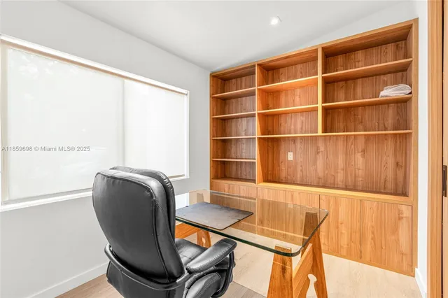 a room with a chair and a window