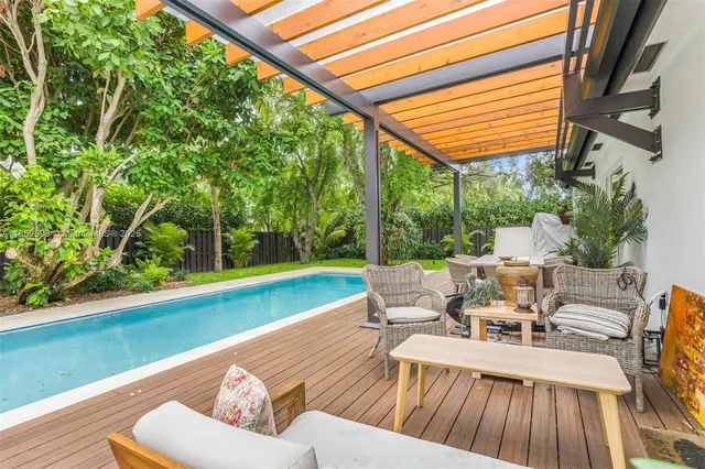 a view of a room with wooden floor and yard