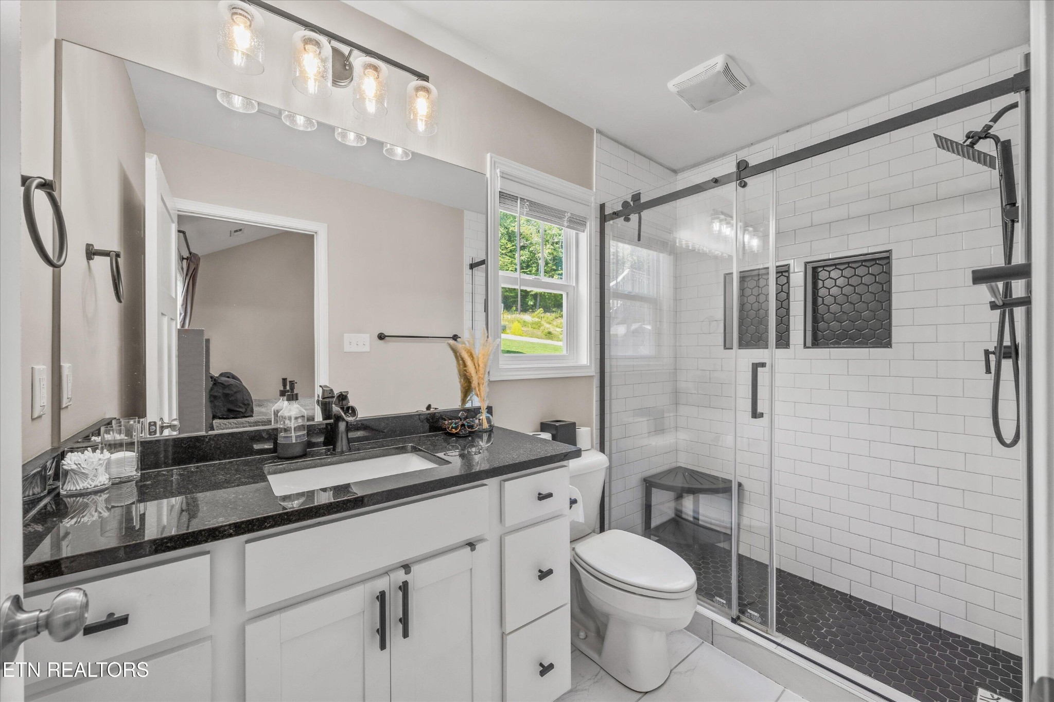 207 Daniel Morris Point Clinton, TN 37716 - Photo 16 of 42 a bathroom with a granite countertop sink toilet and shower