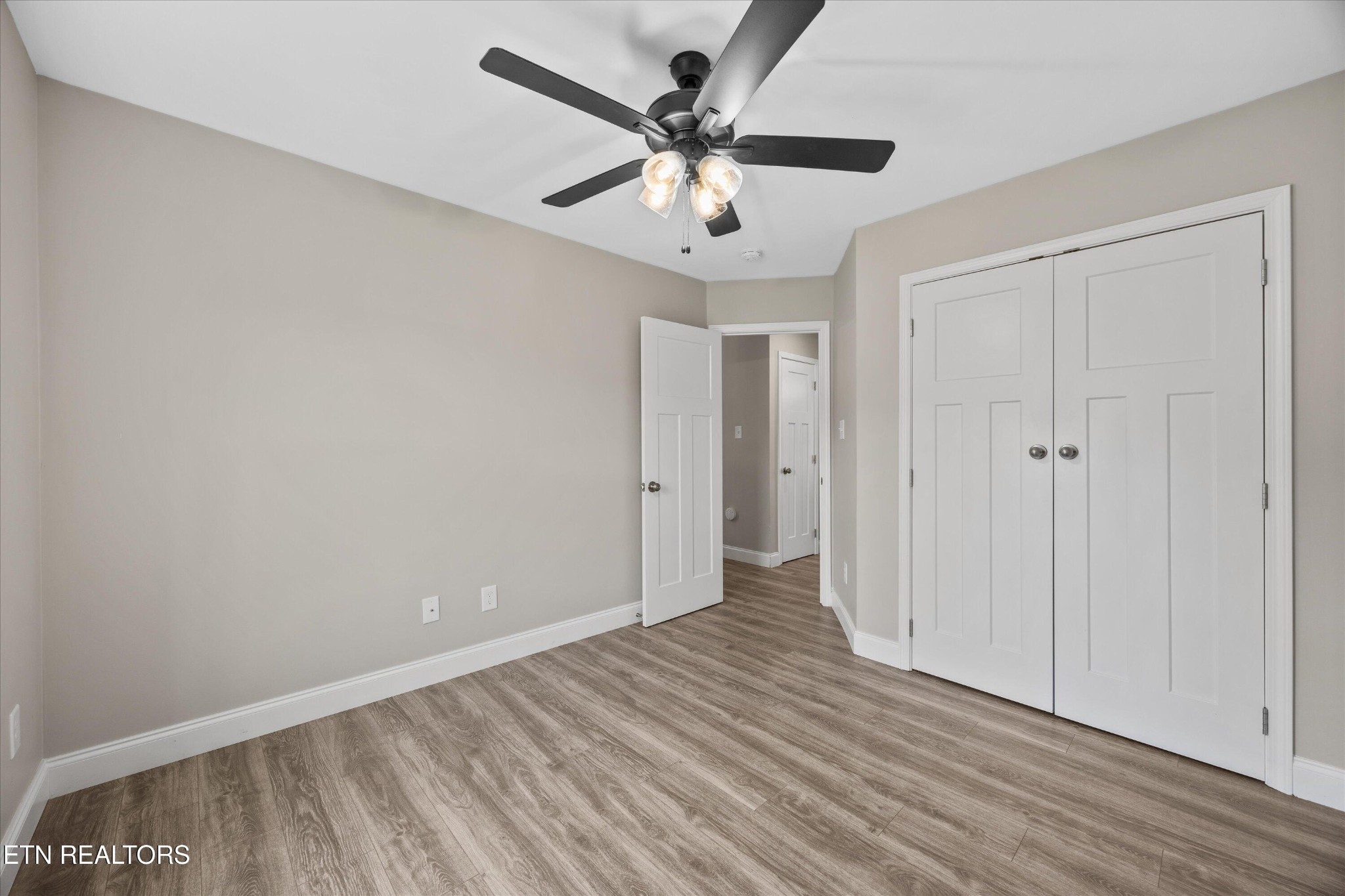 207 Daniel Morris Point Clinton, TN 37716 - Photo 18 of 42 a view of an empty room with wooden floor