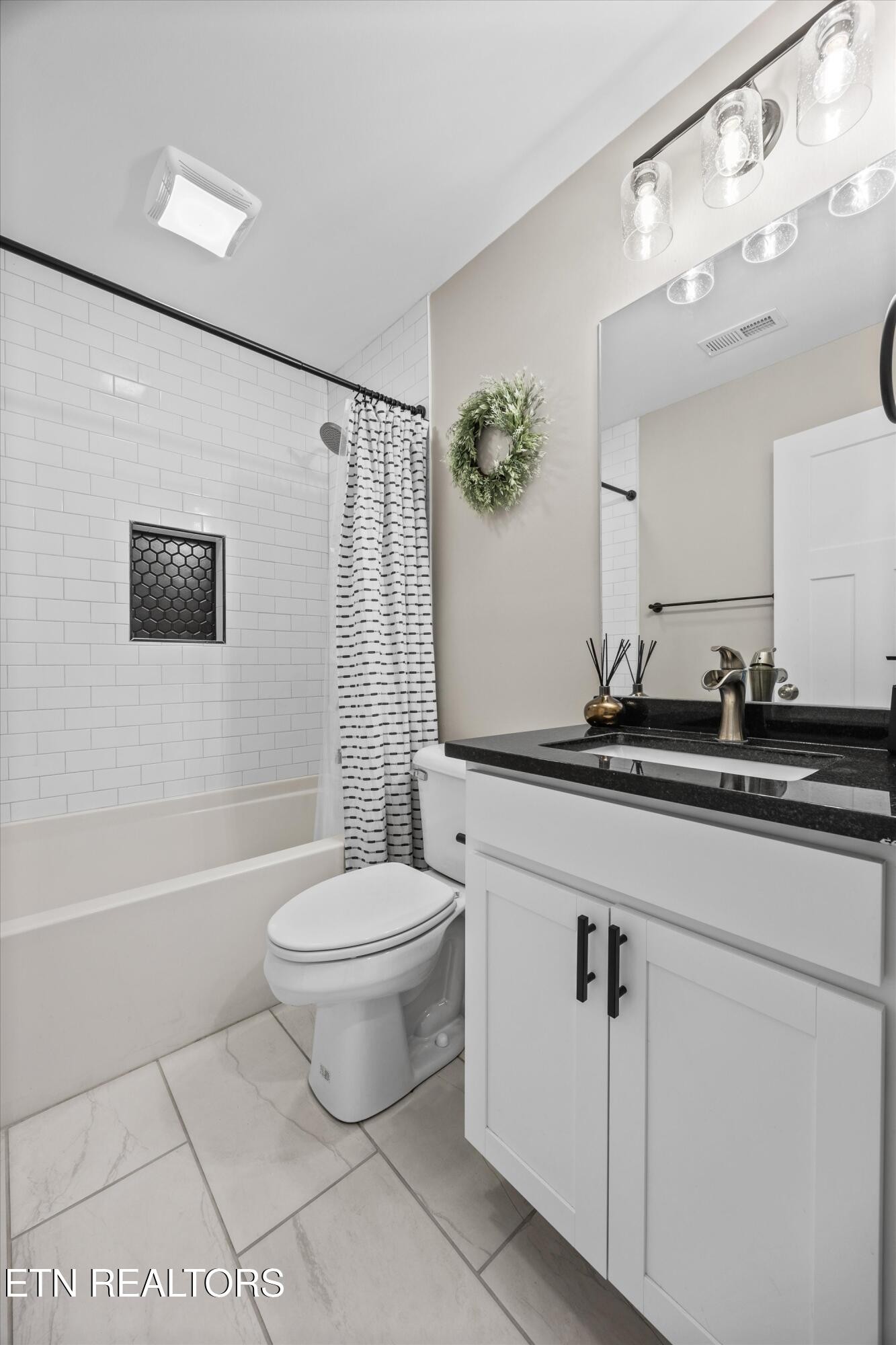 207 Daniel Morris Point Clinton, TN 37716 - Photo 19 of 42 a bathroom with a toilet sink and mirror