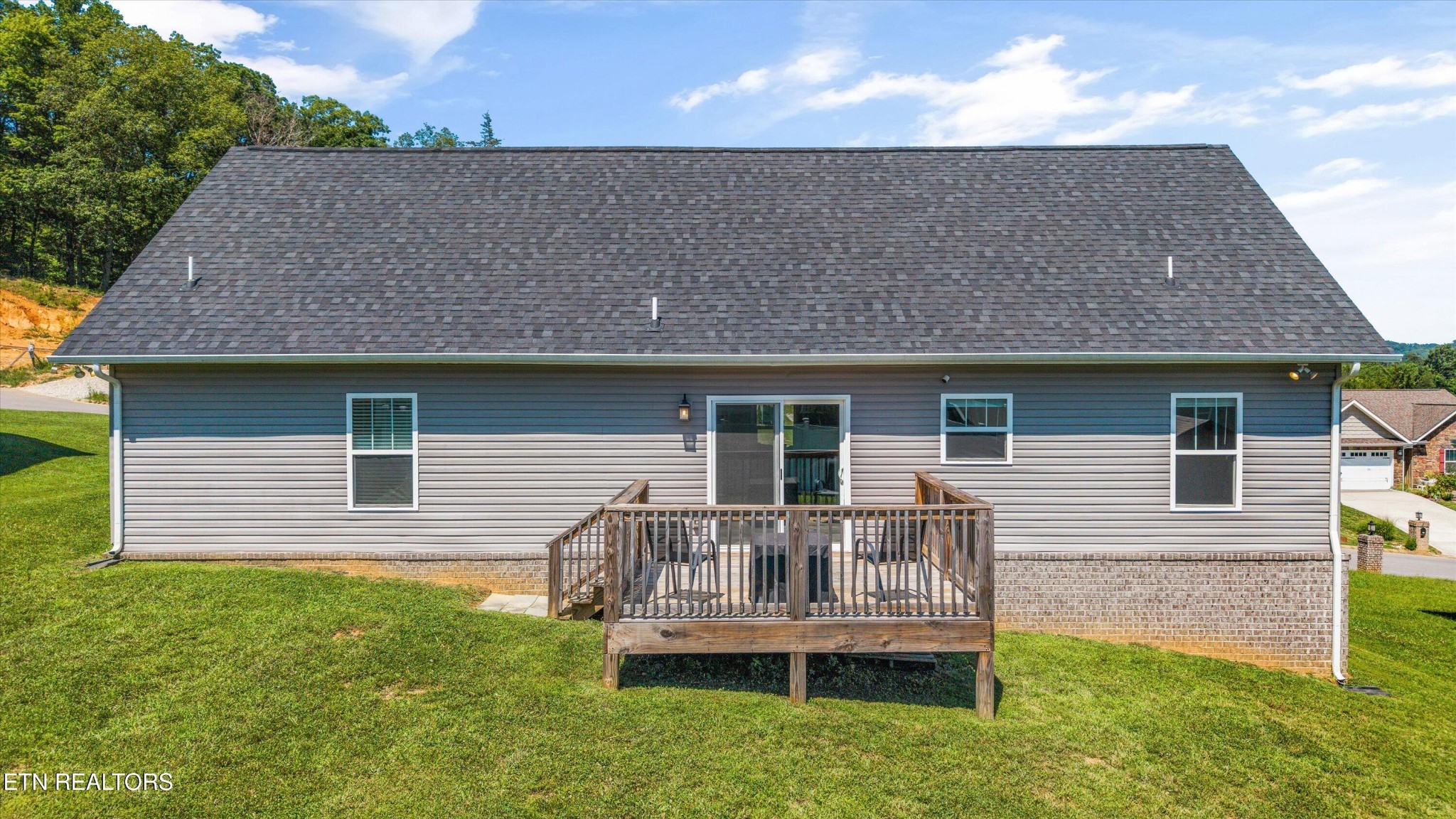 207 Daniel Morris Point Clinton, TN 37716 - Photo 23 of 42 a house view with a garden space