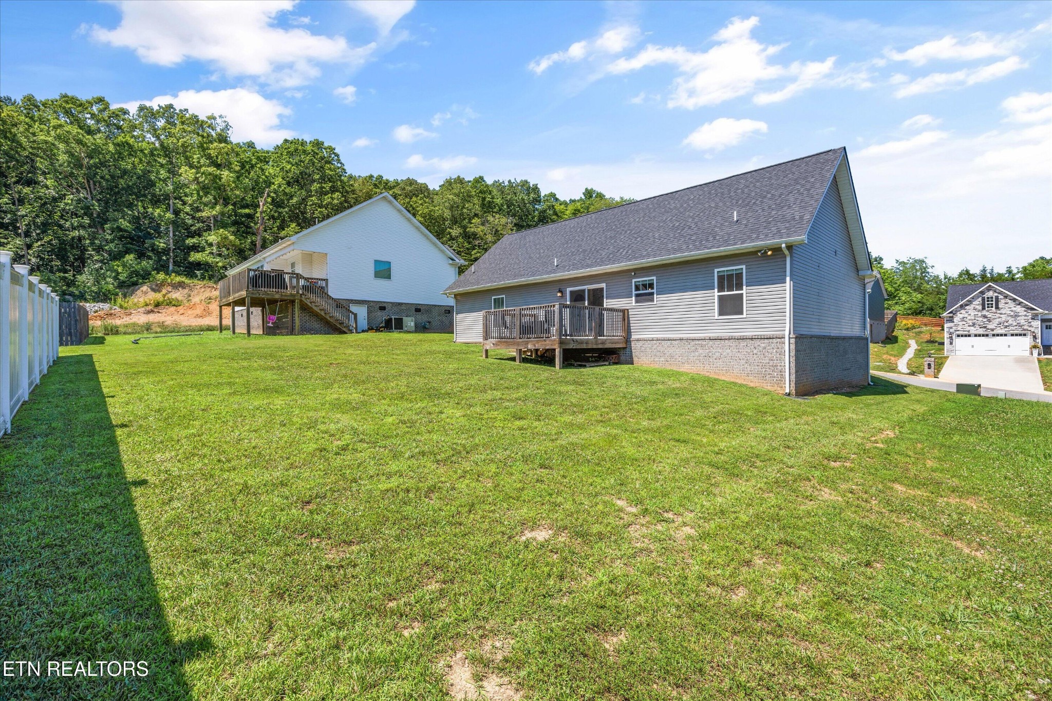 207 Daniel Morris Point Clinton, TN 37716 - Photo 26 of 42 a view of a house with a big yard and large tree