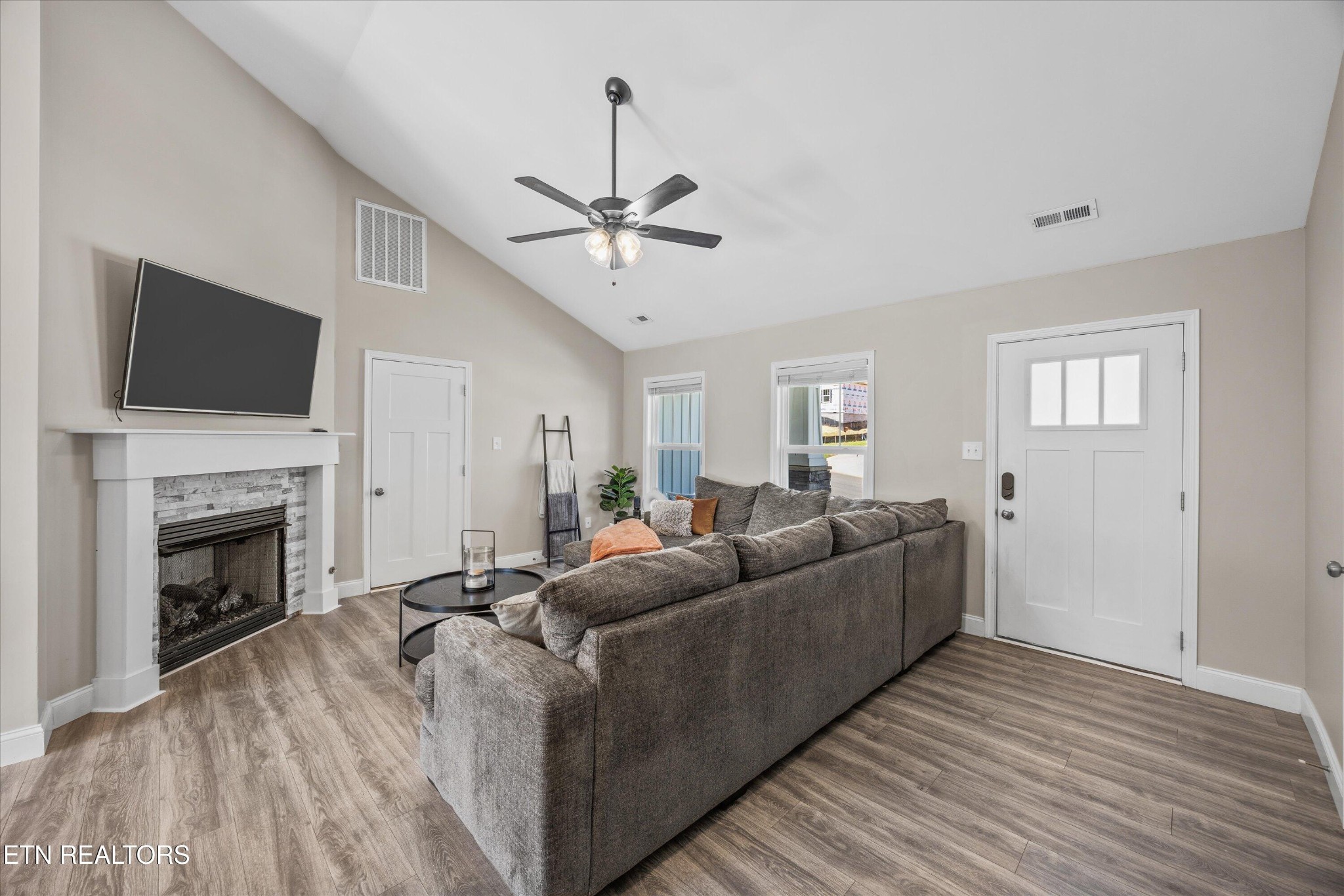 207 Daniel Morris Point Clinton, TN 37716 - Photo 4 of 42 a living room with furniture fireplace and flat screen tv