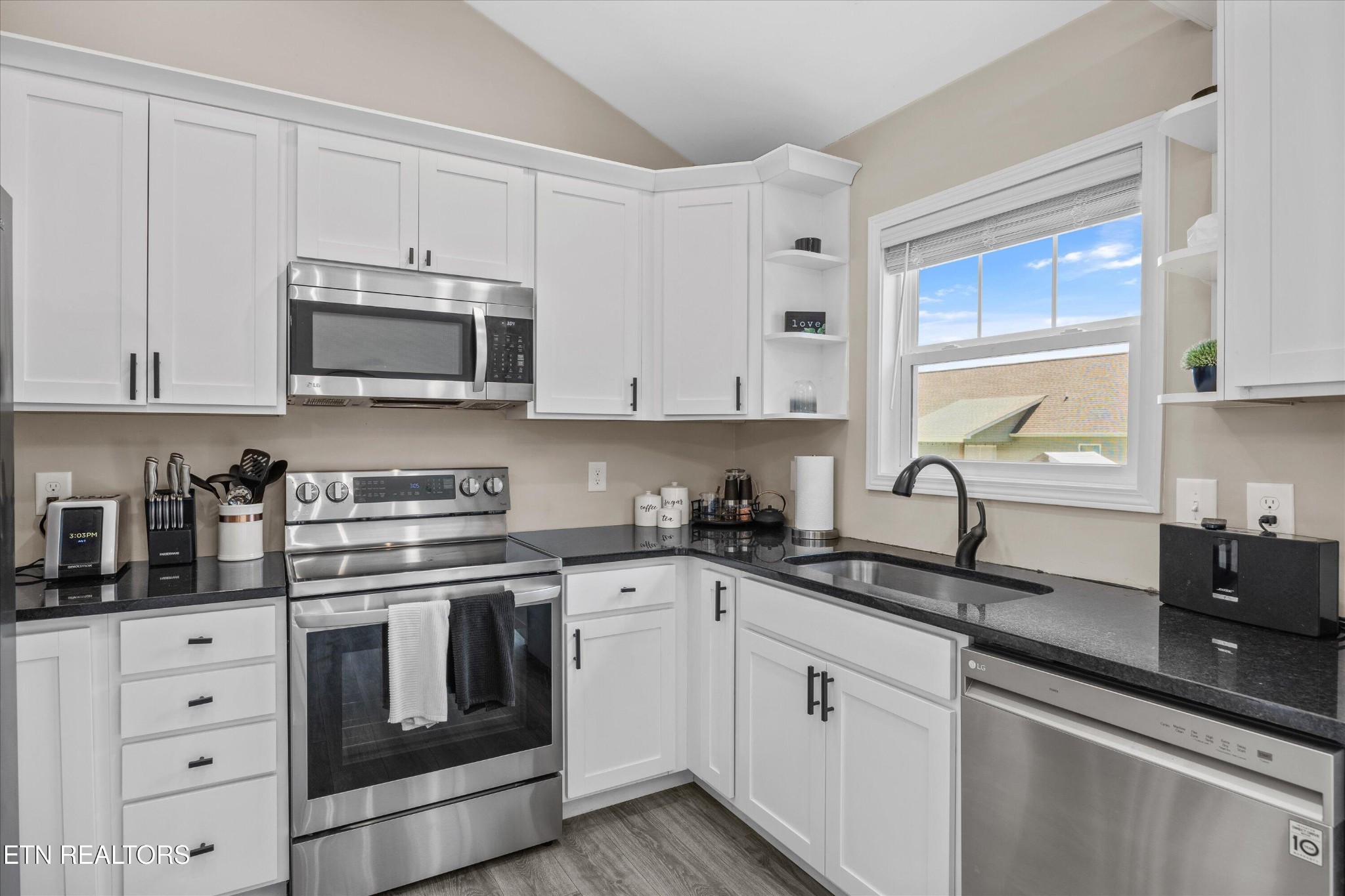 207 Daniel Morris Point Clinton, TN 37716 - Photo 10 of 42 a kitchen with cabinets stainless steel appliances a sink and a window