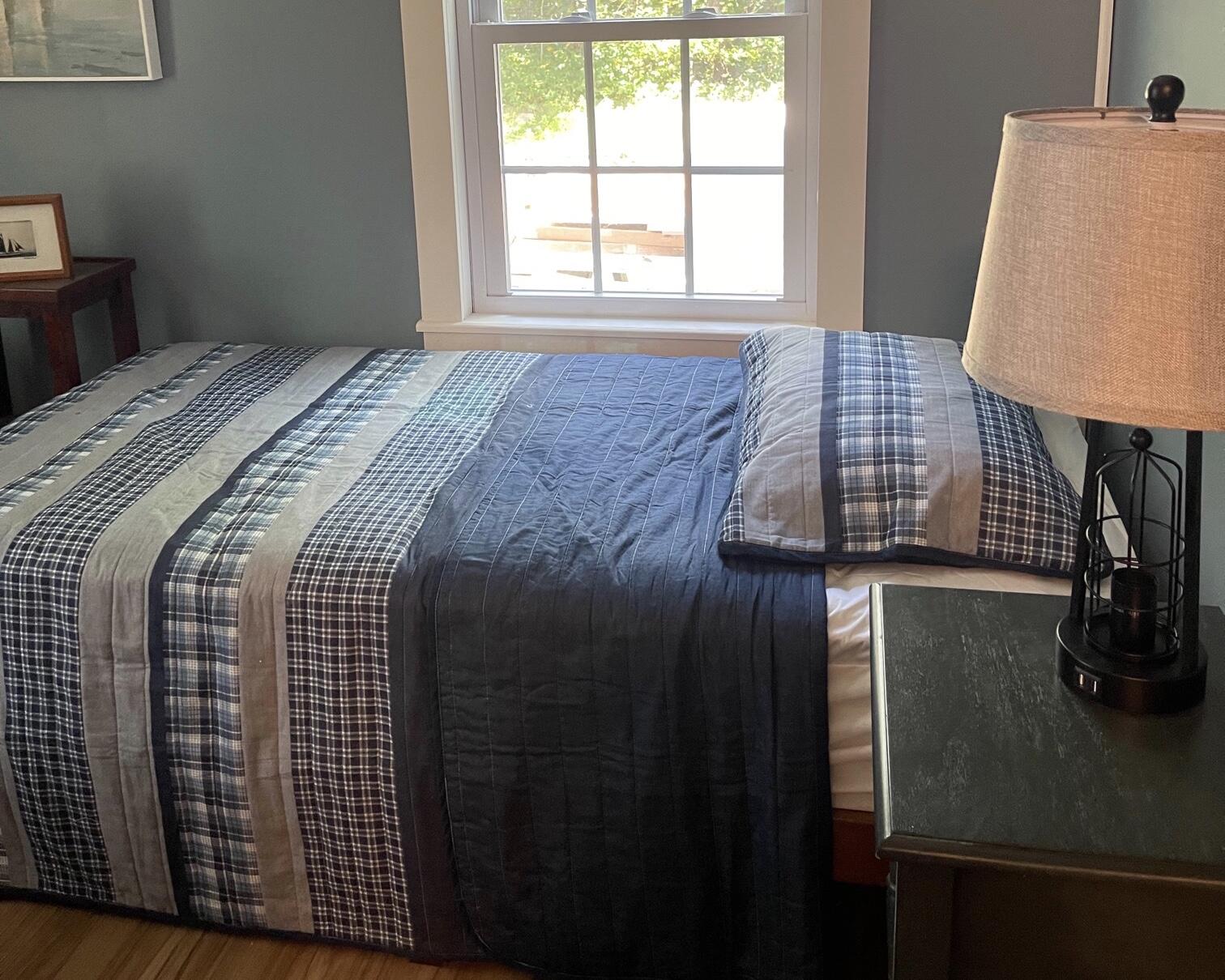 25 Walker Road Eastham, MA 02642 - Photo 14 of 17 a bedroom with a bed and a window