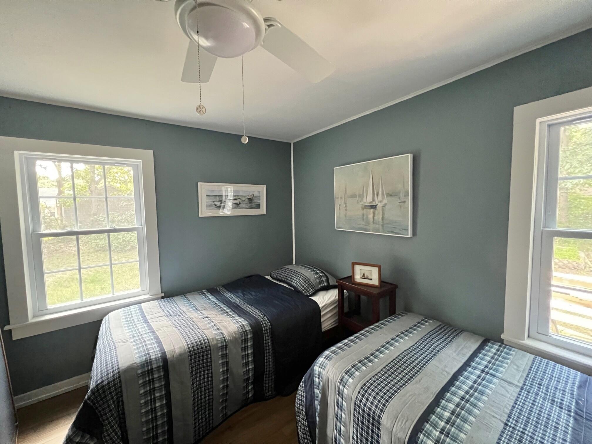 25 Walker Road Eastham, MA 02642 - Photo 15 of 17 a bedroom with two beds and a window