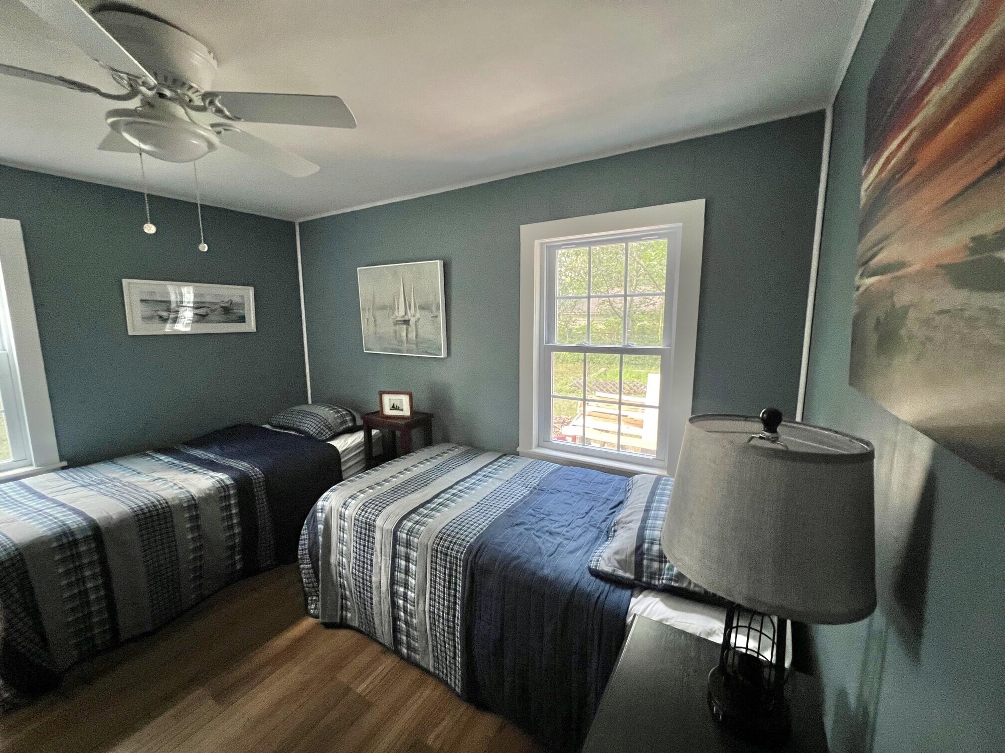 25 Walker Road Eastham, MA 02642 - Photo 16 of 17 a bedroom with two beds and a window