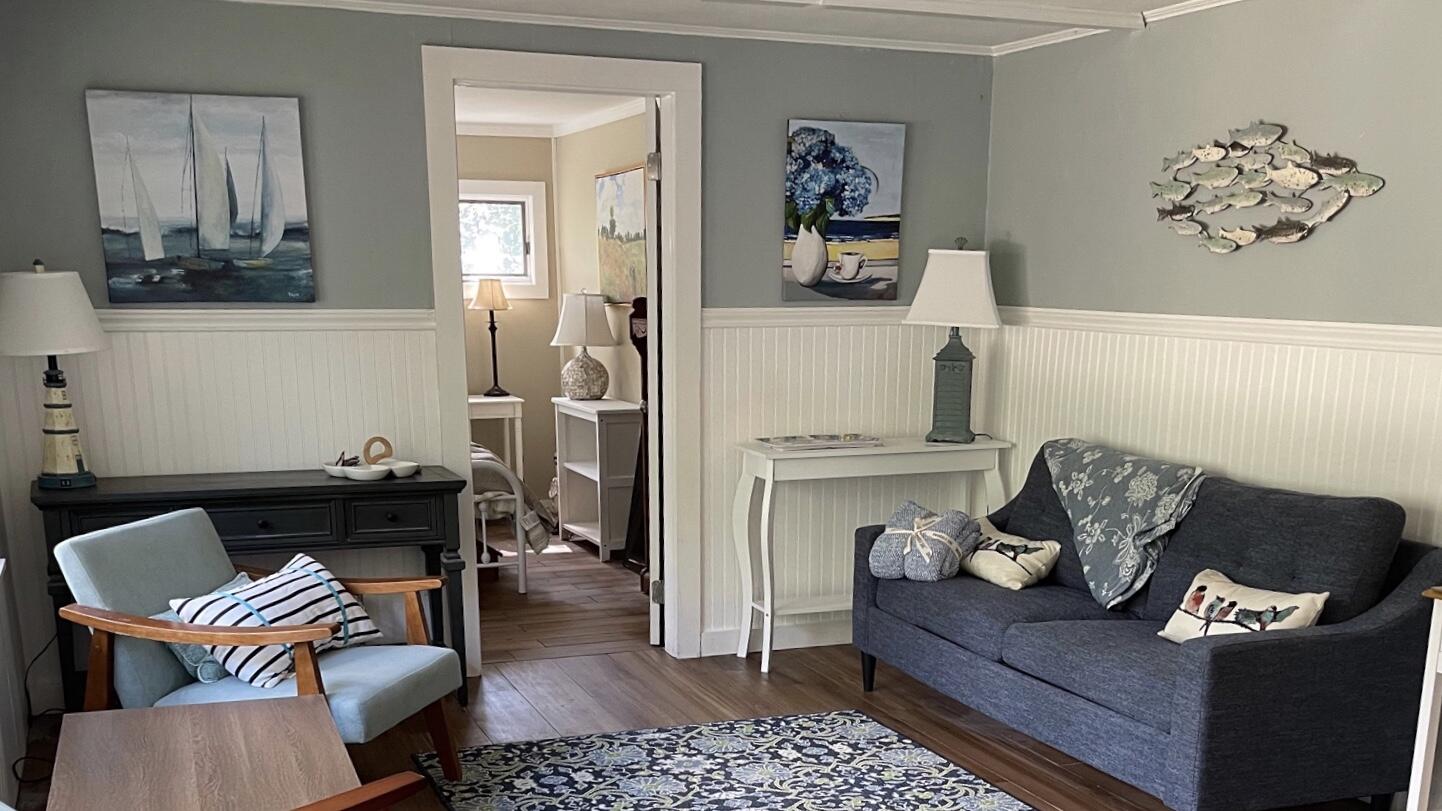 25 Walker Road Eastham, MA 02642 - Photo 2 of 17 a living room with furniture and a couch