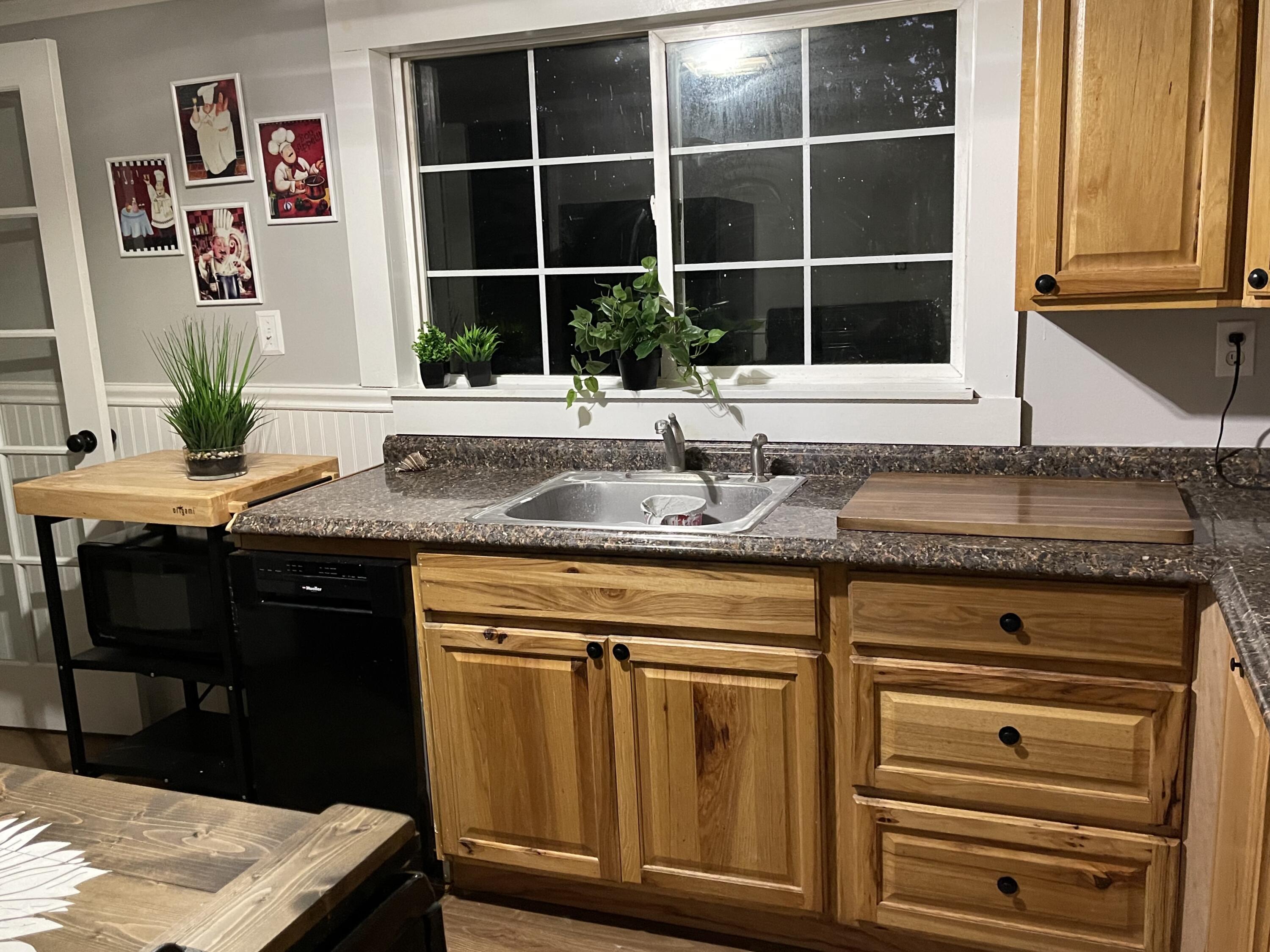 25 Walker Road Eastham, MA 02642 - Photo 6 of 17 a kitchen with granite countertop a sink and a window