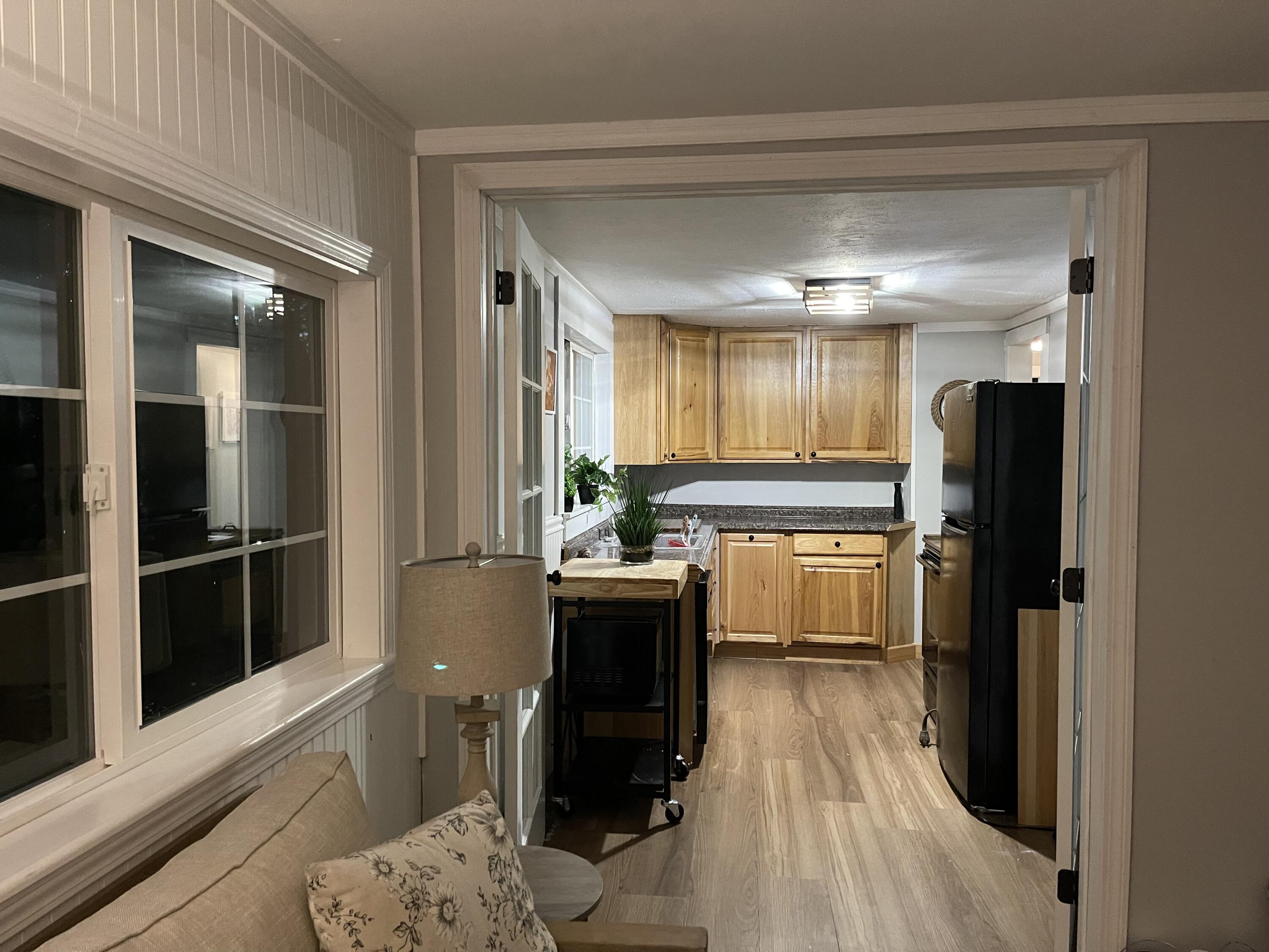 25 Walker Road Eastham, MA 02642 - Photo 8 of 17 a kitchen with a refrigerator and wooden floor