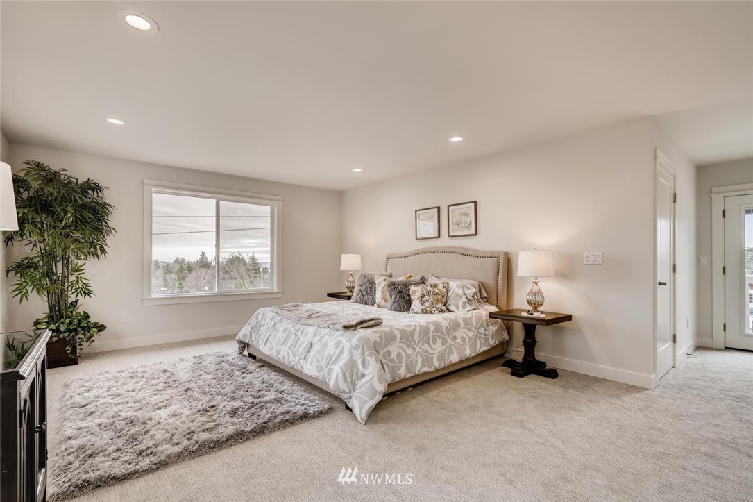 1533 33rd Avenue Seattle, WA 98122 - Photo 14 of 28 a spacious bedroom with a bed and a window