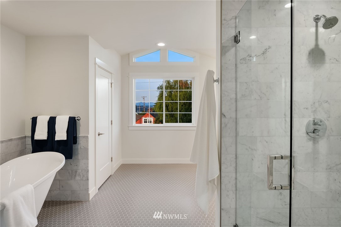 1533 33rd Avenue Seattle, WA 98122 - Photo 18 of 28 a bathroom with a bathtub and a shower