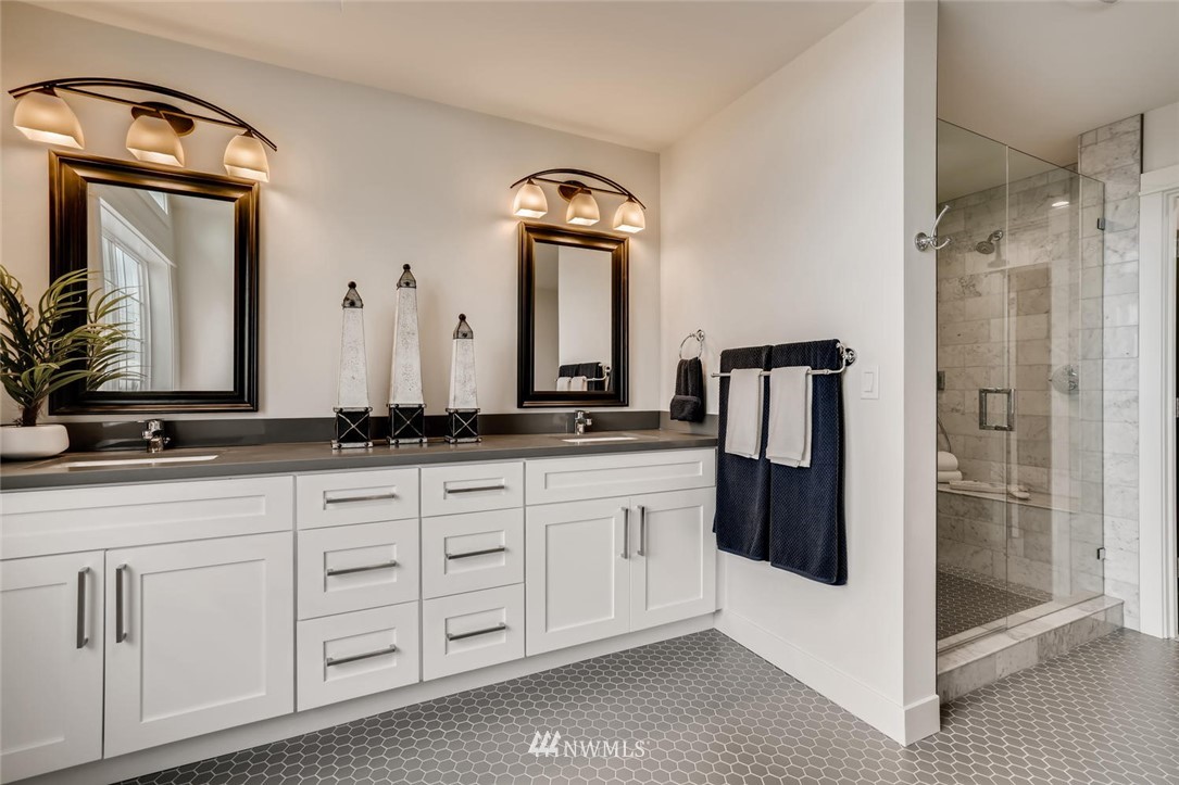 1533 33rd Avenue Seattle, WA 98122 - Photo 19 of 28 a bathroom with a double vanity sink and a mirror