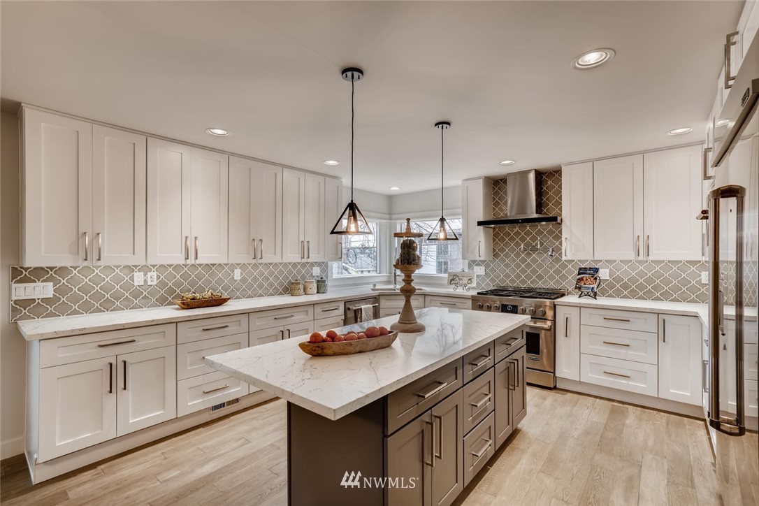 1533 33rd Avenue Seattle, WA 98122 - Photo 10 of 28 a kitchen with a sink stove and cabinets