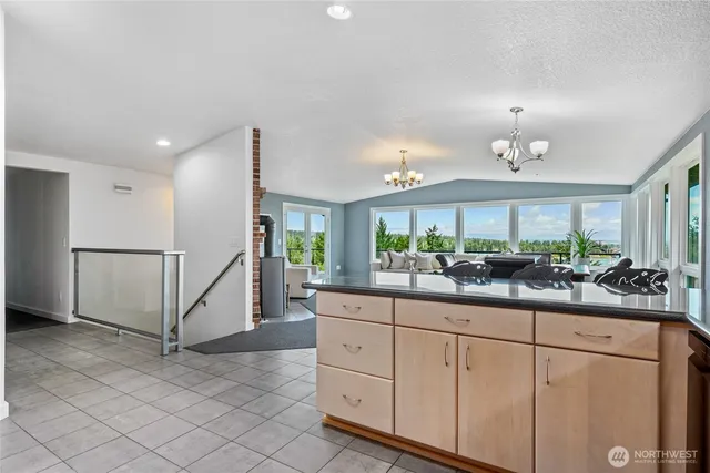a kitchen with counter top space and cabinets