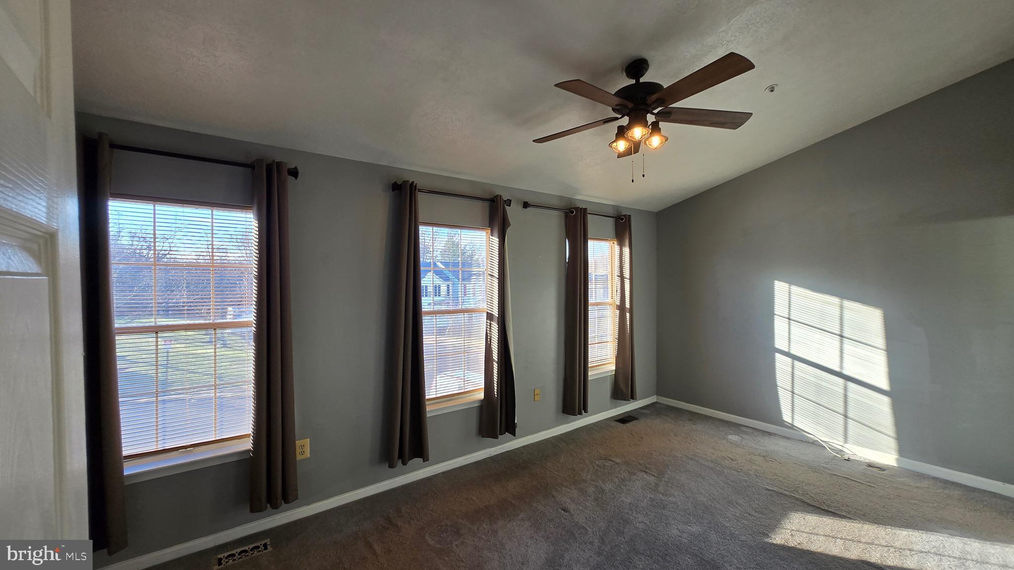 6565 Ronald Road Capitol Heights, MD 20743 - Photo 7 of 20 wooden floor in an empty room with a window