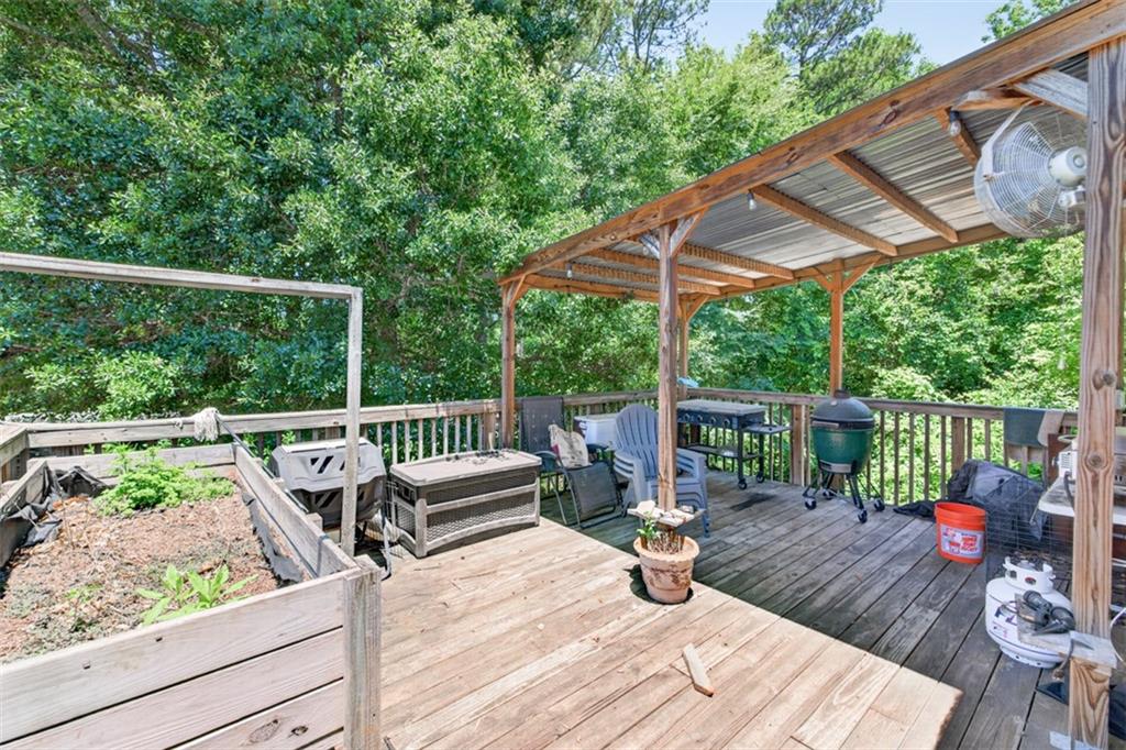 89 Katie Spring Lane Jefferson, GA 30549 - Photo 50 of 63 a view of deck with furniture and trees in the background