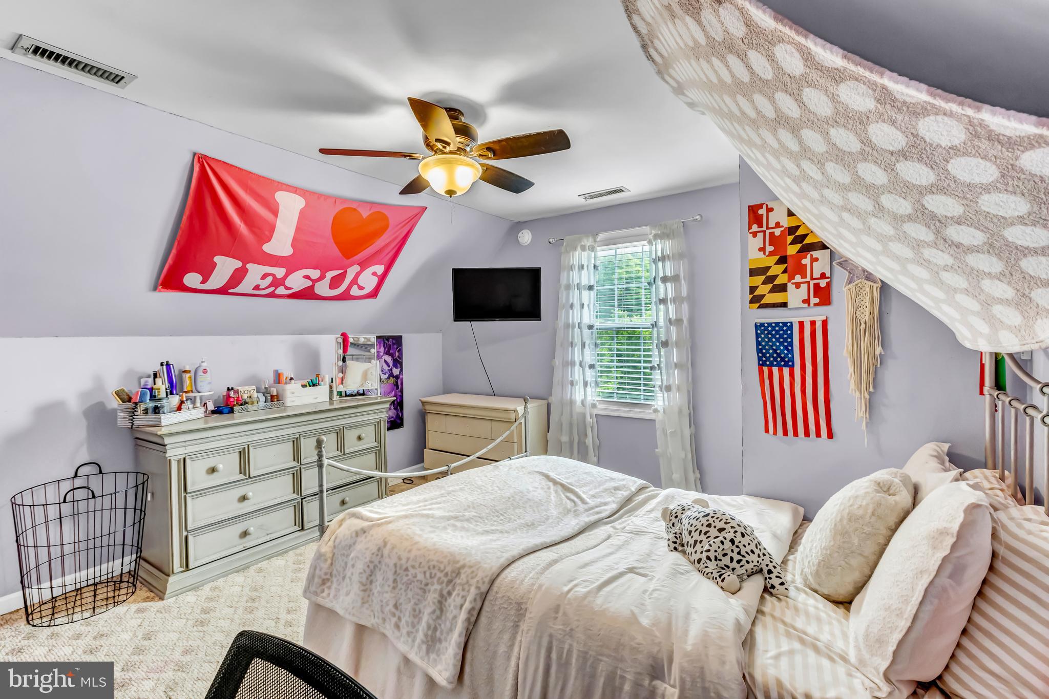 4925 Campground Road Eden, MD 21822 - Photo 28 of 42 a bedroom with a bed and a chandelier