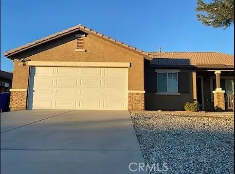 a front view of a house with a outdoor space