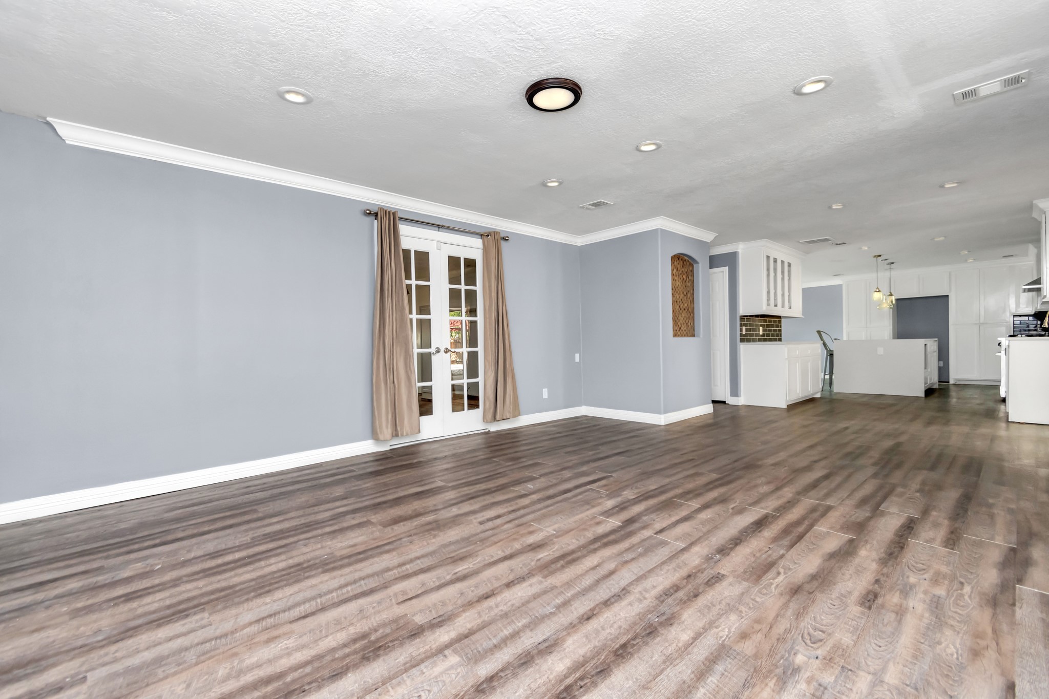 12418 Mill Ridge Drive Cypress, TX 77429 - Photo 11 of 36 a view of an empty room with wooden floor and a window