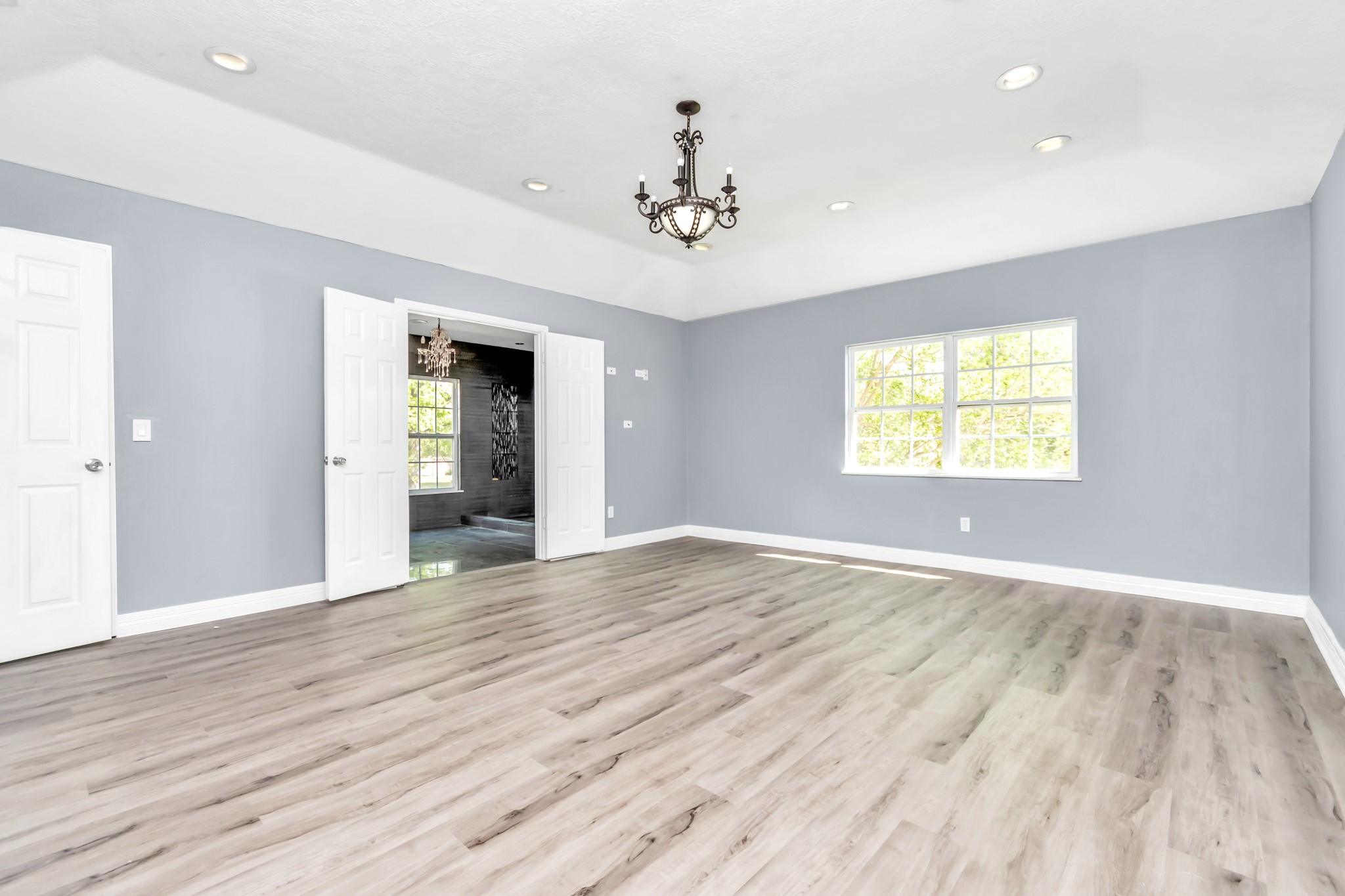 12418 Mill Ridge Drive Cypress, TX 77429 - Photo 15 of 36 wooden floor in an empty room with a window