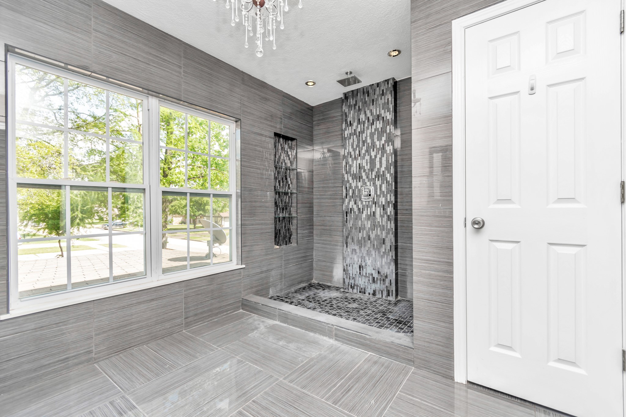 12418 Mill Ridge Drive Cypress, TX 77429 - Photo 18 of 36 a view of a bathroom with a shower curtain and a large window