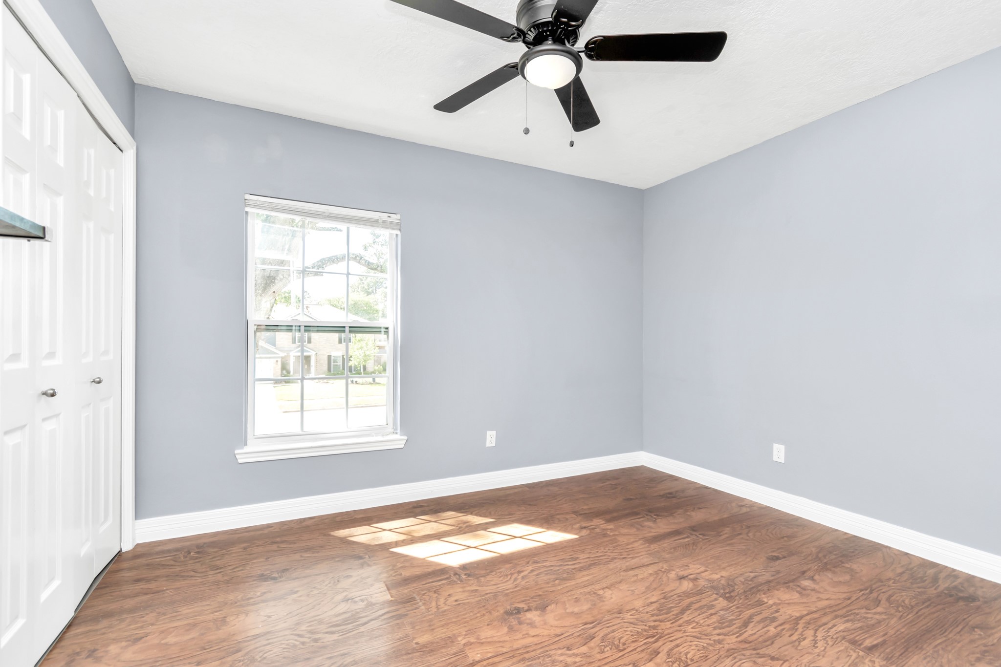 12418 Mill Ridge Drive Cypress, TX 77429 - Photo 22 of 36 an empty room with a window and a fan