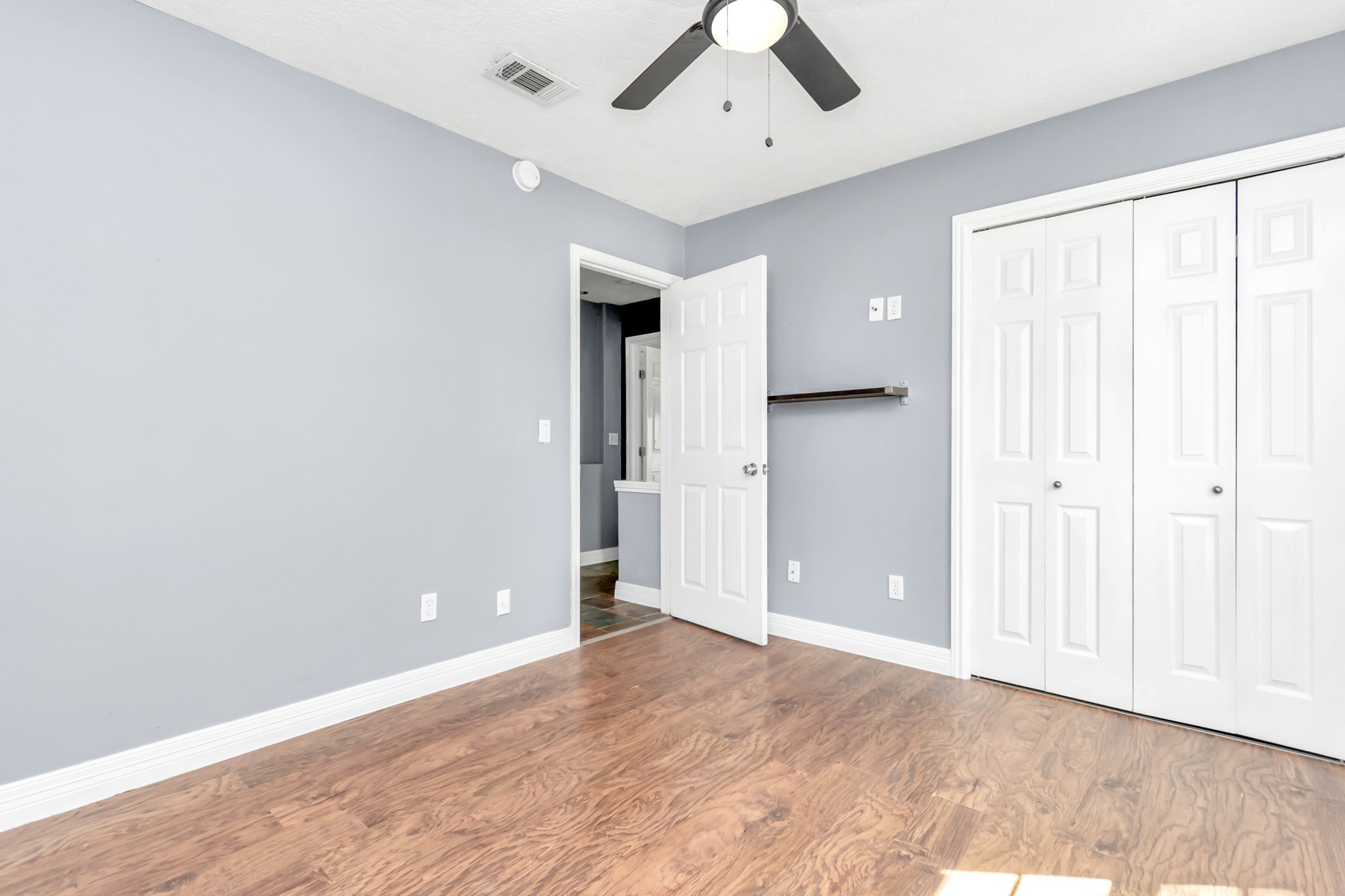 12418 Mill Ridge Drive Cypress, TX 77429 - Photo 23 of 36 wooden floor in an empty room with a window
