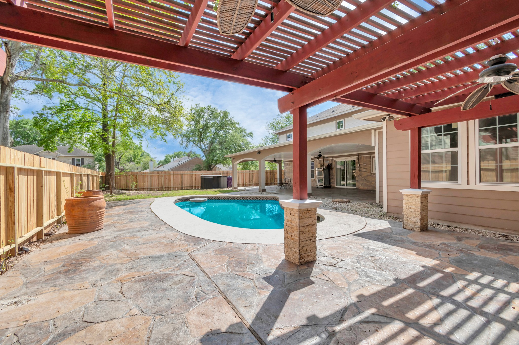12418 Mill Ridge Drive Cypress, TX 77429 - Photo 32 of 36 a view of a backyard with table and chairs and a barbeque