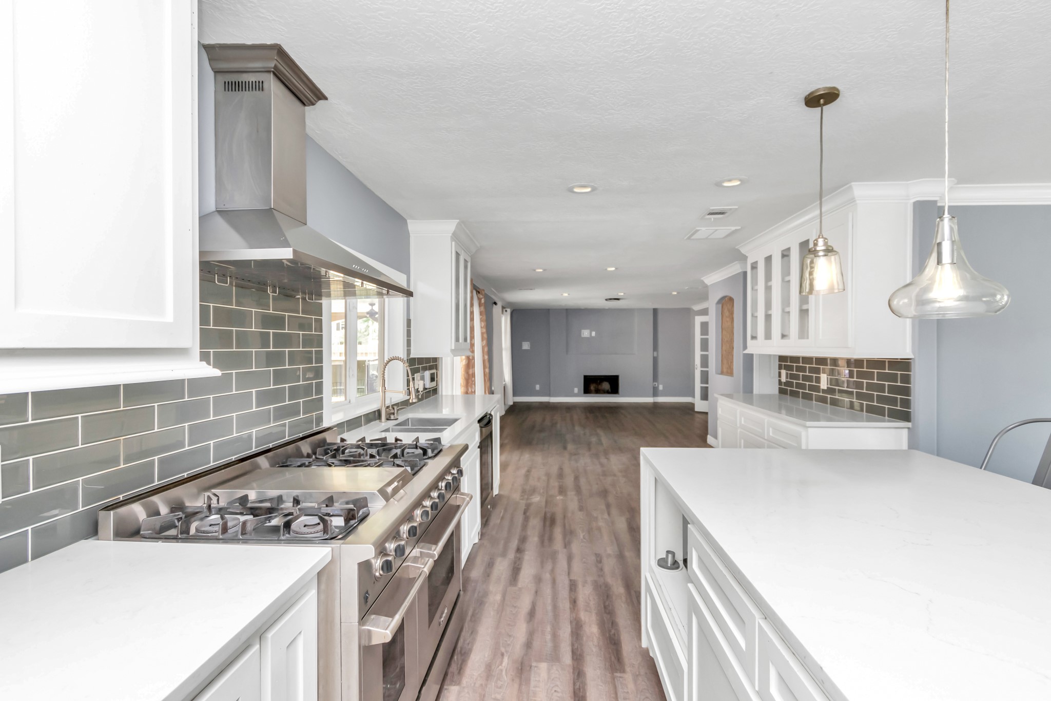 12418 Mill Ridge Drive Cypress, TX 77429 - Photo 5 of 36 a kitchen with a stove and a sink