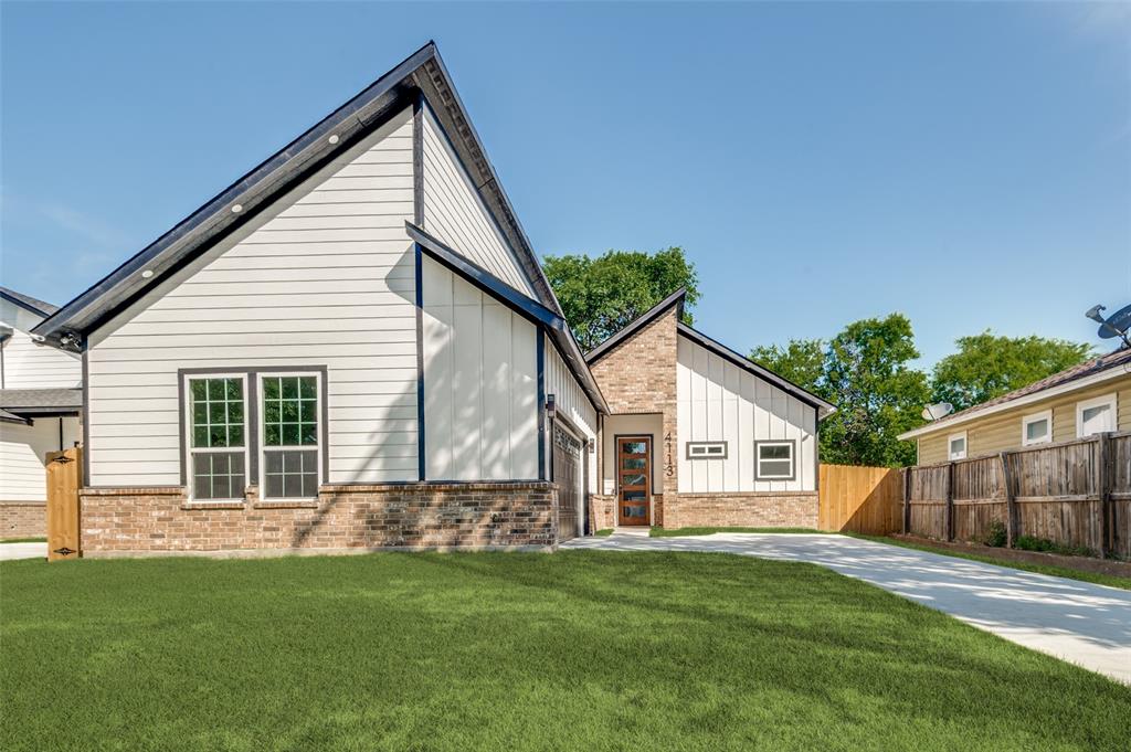 4113 Metropolitan Avenue Dallas, TX 75210 - Photo 3 of 30 a front view of a house with a yard