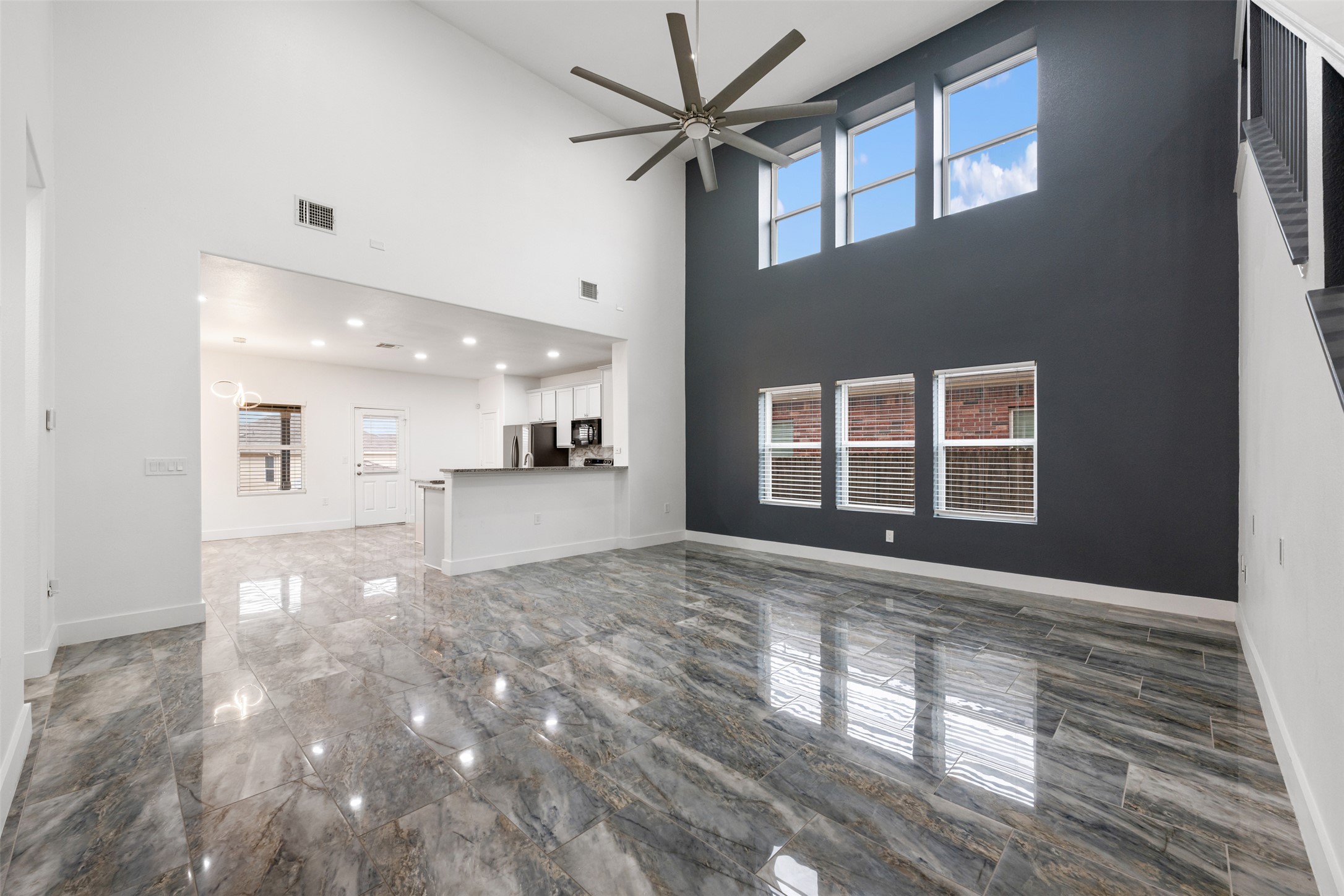 3400 Stephans Street Pflugerville, TX 78660 - Photo 11 of 40 a view of an empty room with a window and kitchen view