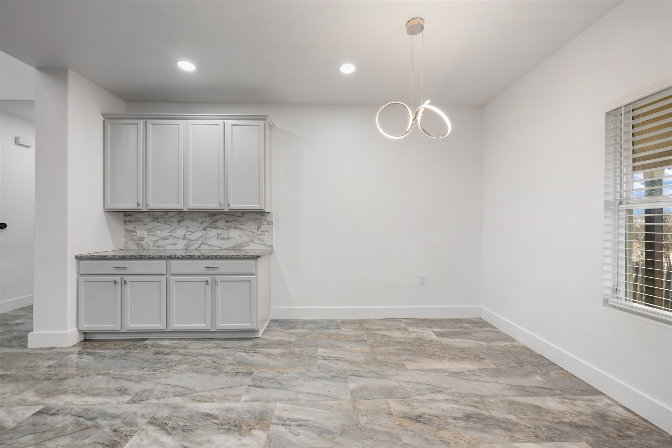3400 Stephans Street Pflugerville, TX 78660 - Photo 20 of 40 a kitchen with granite countertop a sink cabinets and window