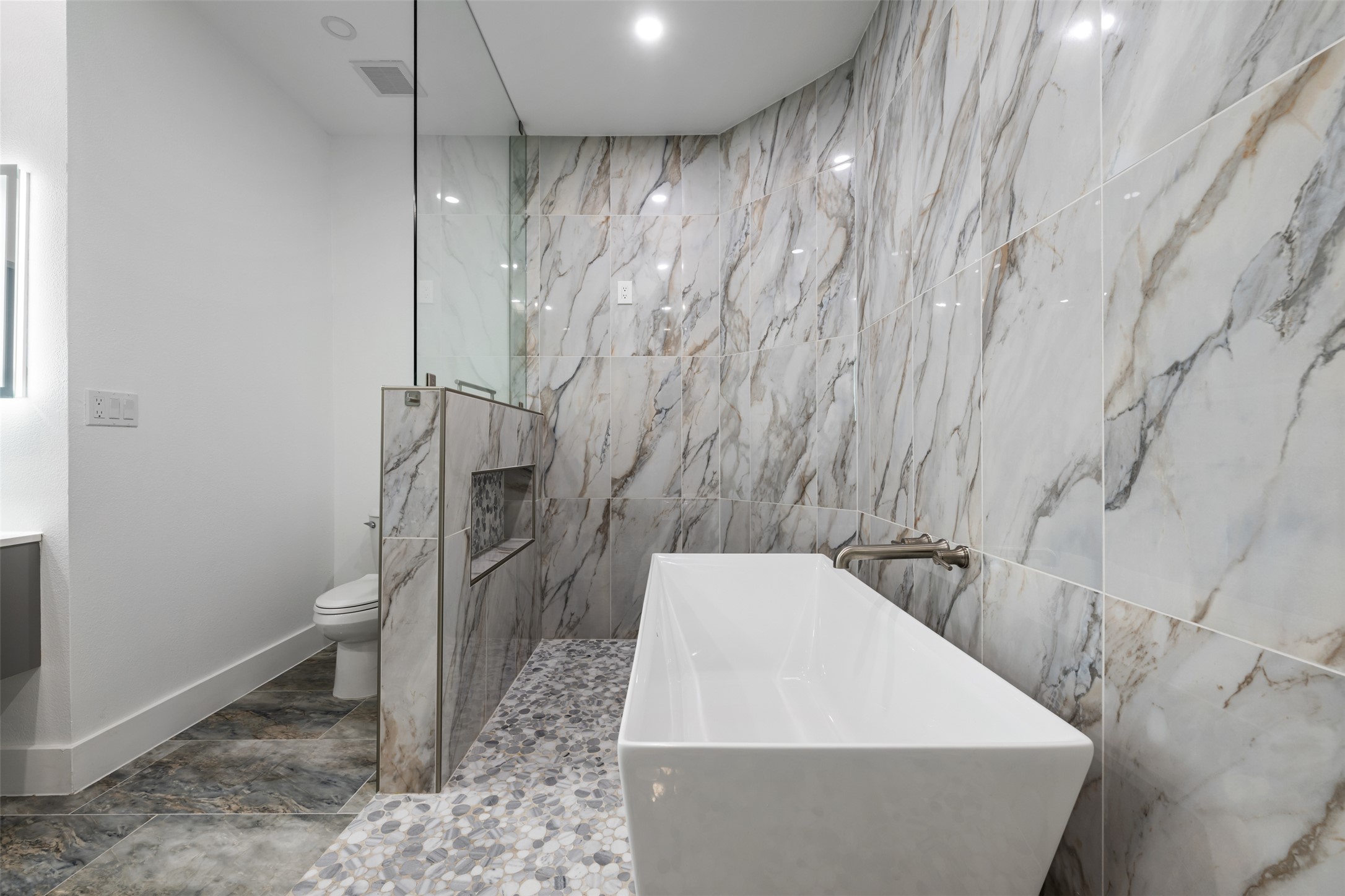 3400 Stephans Street Pflugerville, TX 78660 - Photo 27 of 40 a bathroom with a bathtub and toilet