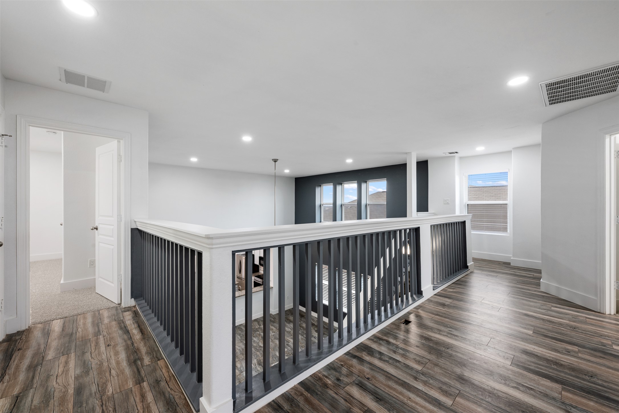 3400 Stephans Street Pflugerville, TX 78660 - Photo 29 of 40 a view of hallway with wooden floor