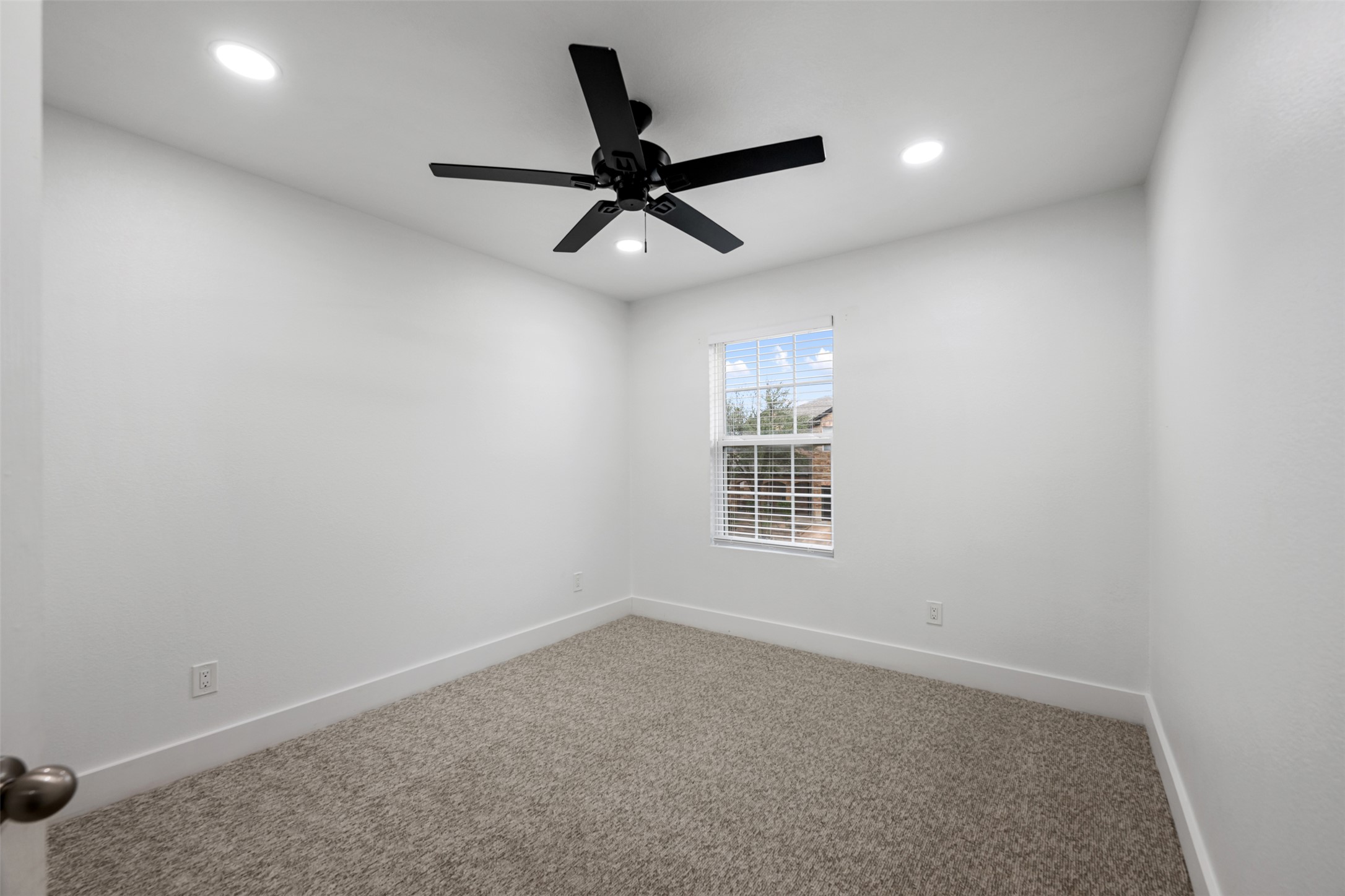 3400 Stephans Street Pflugerville, TX 78660 - Photo 31 of 40 an empty room with a ceiling fan and window