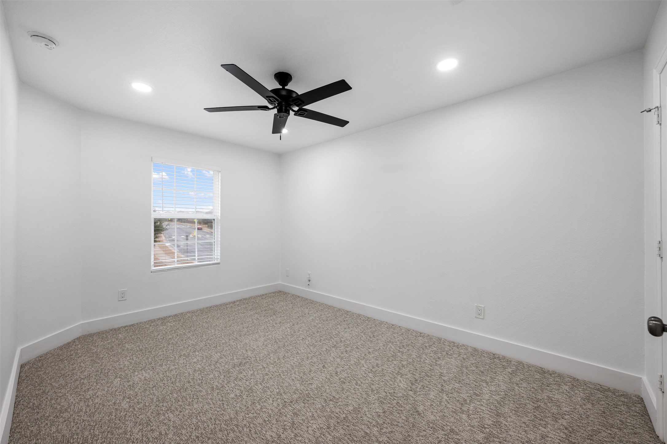 3400 Stephans Street Pflugerville, TX 78660 - Photo 33 of 40 an empty room with a window and a fan